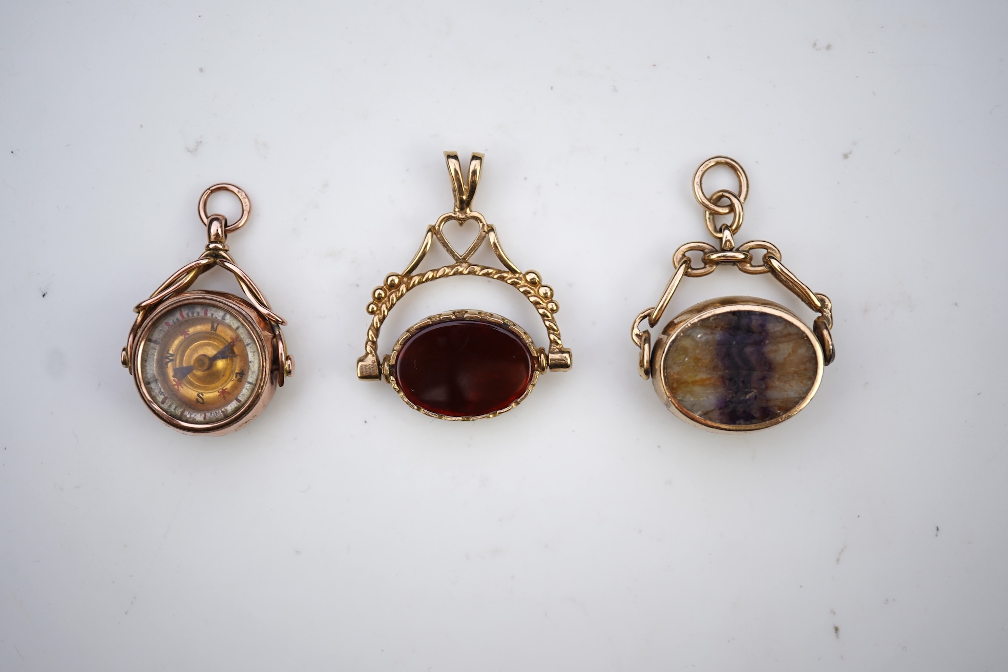Three 9ct gold fob pendants